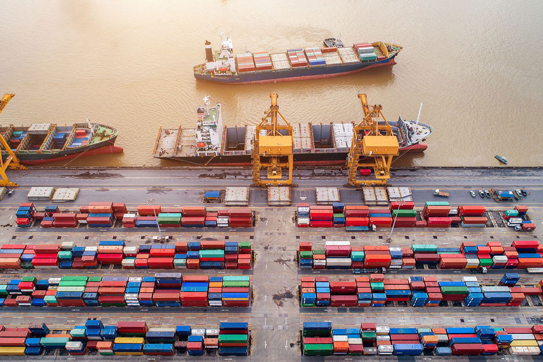 Top view of container and crane, container ship in import export and business logistic cargo to harbor.